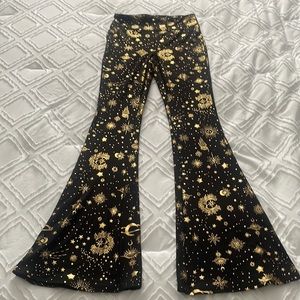 Black flared pants with gold designs